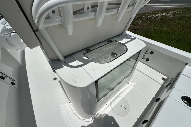 Slide: The Image of 2023 Sea Hunt BX 25 BR boat interior with storage compartment and seating. - 13