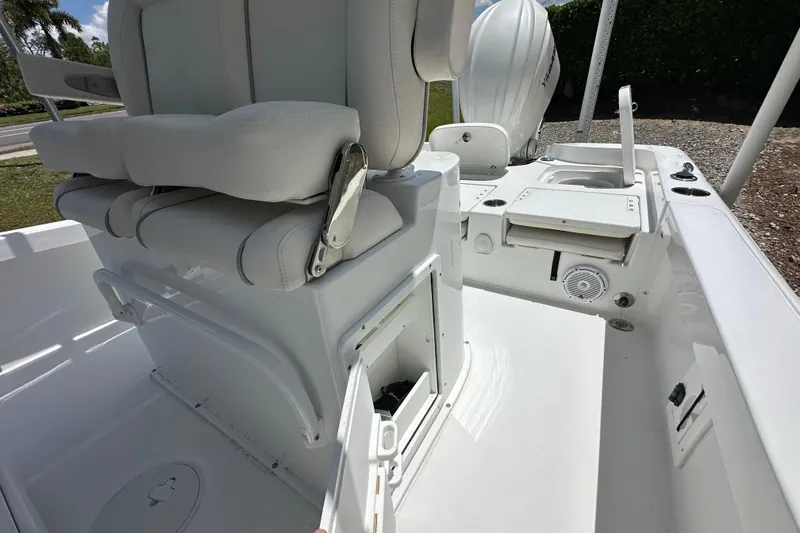 Slide: The Image of 2023 Sea Hunt BX 25 BR boat interior with seating and storage compartments. - 14