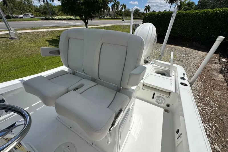 Slide: The Image of 2023 Sea Hunt BX 25 BR boat interior with white seating and console. - 16