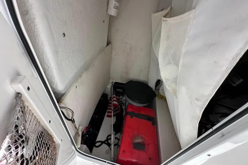Slide: The Image of Storage compartment of 2023 Sea Hunt BX 25 BR boat with equipment and supplies. - 20