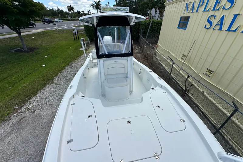 Slide: The Image of 2023 Sea Hunt BX 25 BR boat docked near Naples Sales building. - 23