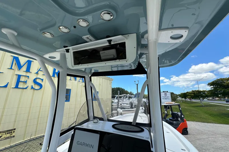 Slide: The Image of 2023 Sea Hunt BX 25 BR boat interior with Garmin electronics at marina. - 24