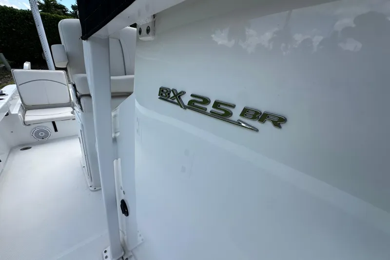 Slide: The Image of 2023 Sea Hunt BX 25 BR boat interior with logo detail. - 25