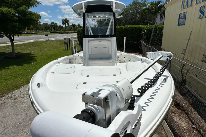 Slide: The Image of 2023 Sea Hunt BX 25 BR boat with trolling motor, parked outdoors on a sunny day. - 3
