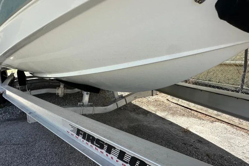 Slide: The Image of 2023 Sea Hunt BX 25 BR boat on a First Load trailer, side view. - 5