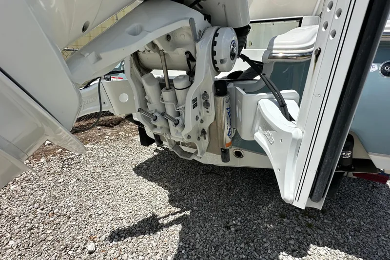 Slide: The Image of 2023 Sea Hunt BX 25 BR boat engine detail on gravel surface. - 6
