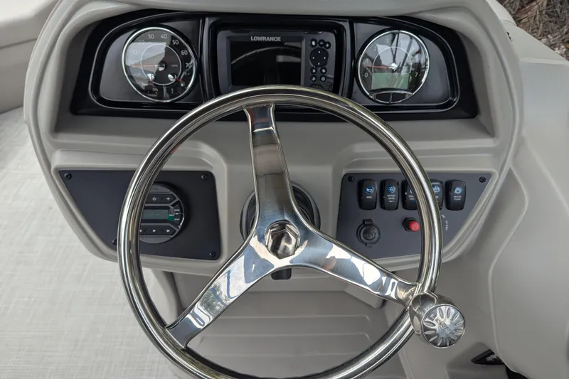 Slide: The Image of Steering console of 2026 Dockside 22DQ2.75 boat with gauges and controls. - 3