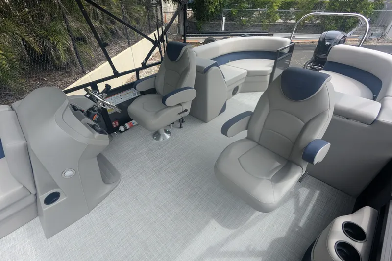 Slide: The Image of Luxurious 2026 Dockside 22DQ2.75 boat interior with plush seating and modern helm. - 4