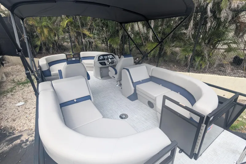 Slide: The Image of Modern Dockside 22DQ2.75 pontoon boat interior, 2026 model, featuring spacious seating and sleek design. - 7
