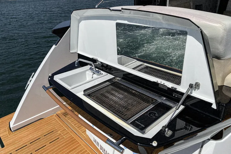 Slide: The Image of Outdoor grill and sink on 2017 Beneteau Gran Turismo 46 yacht, overlooking water. - 11