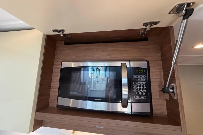Slide: The Image of Built-in microwave in 2017 Beneteau Gran Turismo 46 yacht kitchen cabinet. - 17