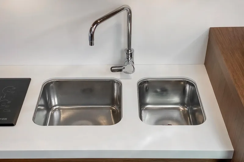 Slide: The Image of Modern kitchen sink with dual basins and sleek faucet on Beneteau Gran Turismo 46 yacht. - 18