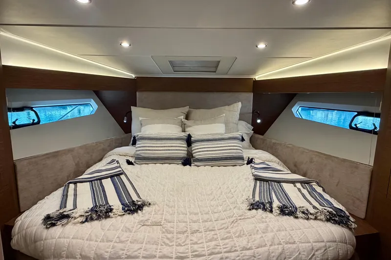 Slide: The Image of Luxurious cabin interior of 2017 Beneteau Gran Turismo 46 yacht with cozy bedding. - 20