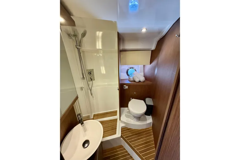 Slide: The Image of Luxurious bathroom in 2017 Beneteau Gran Turismo 46 yacht with shower and toilet. - 21