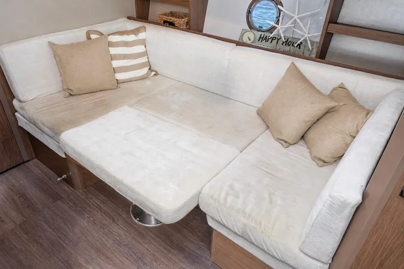 Slide: The Image of Luxurious interior of 2017 Beneteau Gran Turismo 46 yacht with cozy seating and cushions. - 26