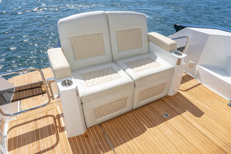 Slide: The Image of Luxury seating on 2017 Beneteau Gran Turismo 46 yacht, featuring elegant design and ocean backdrop. - 4