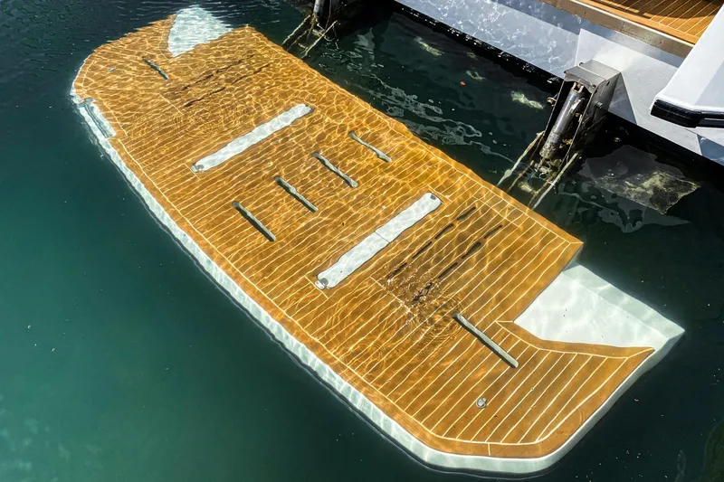 Slide: The Image of Swim platform of 2017 Beneteau Gran Turismo 46 yacht, partially submerged in water. - 6