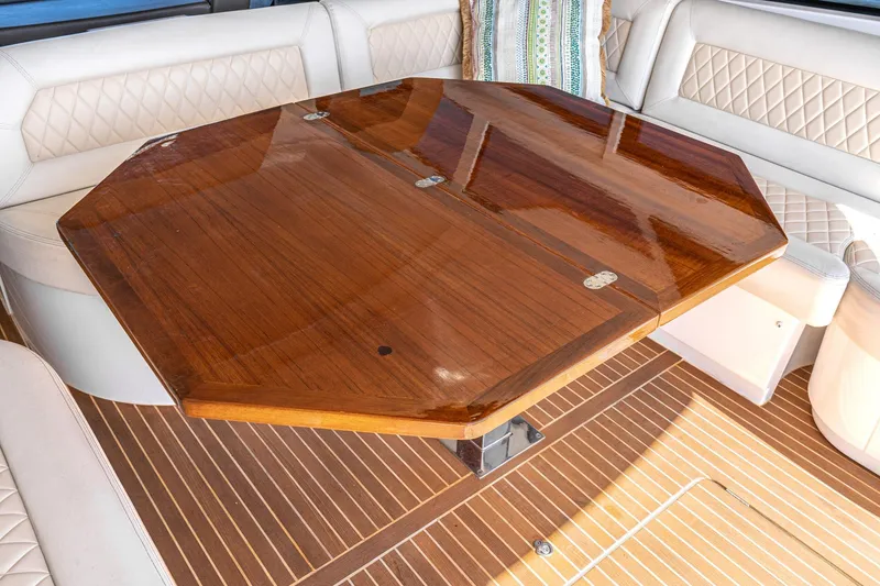 Slide: The Image of Luxurious wooden table on 2017 Beneteau Gran Turismo 46 yacht with elegant seating. - 8