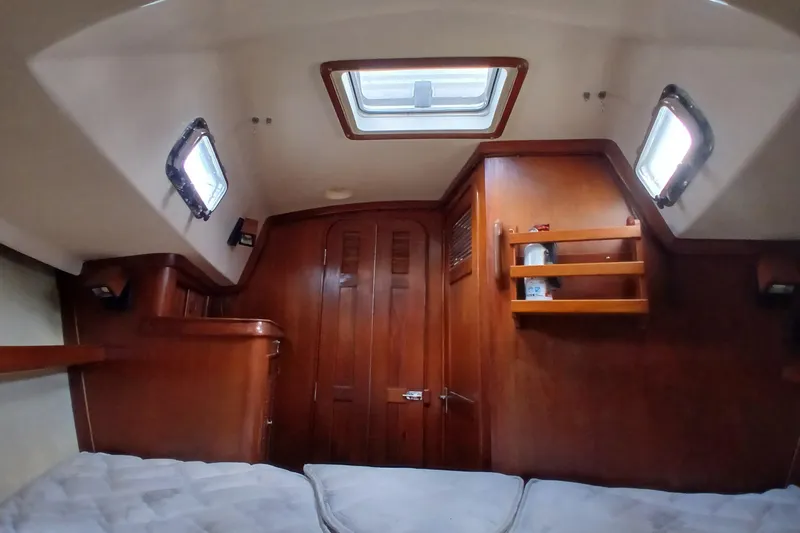 Slide: The Image of Interior cabin of a 1995 Island Packet 37 sailboat with wooden finish. - 20