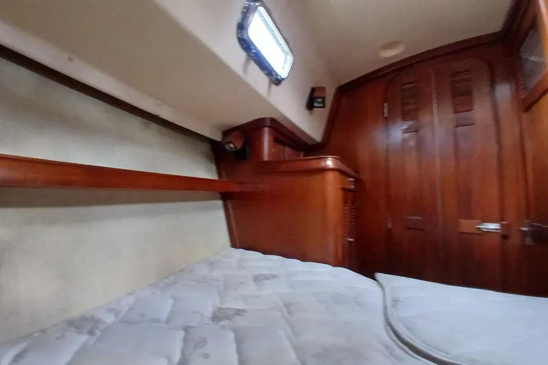 Slide: The Image of Interior cabin of a 1995 Island Packet 37 sailboat with wooden finishes. - 21