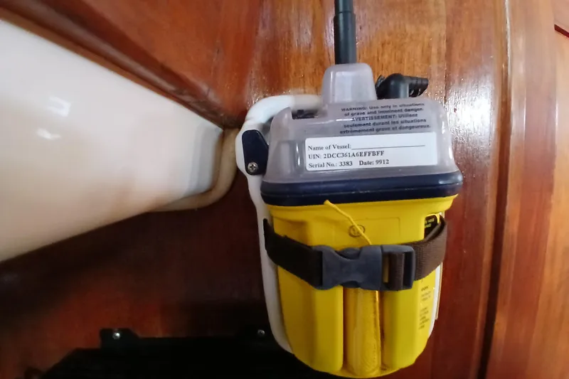 Slide: The Image of Emergency beacon mounted on a 1995 Island Packet 37 sailboat interior. - 42