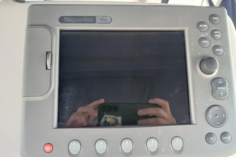 Slide: The Image of Raymarine C80 display on 1995 Island Packet 37 sailboat, showing control buttons and screen. - 50