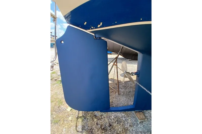 Slide: The Image of 1995 Island Packet 37 sailboat rudder and propeller detail in dry dock. - 63