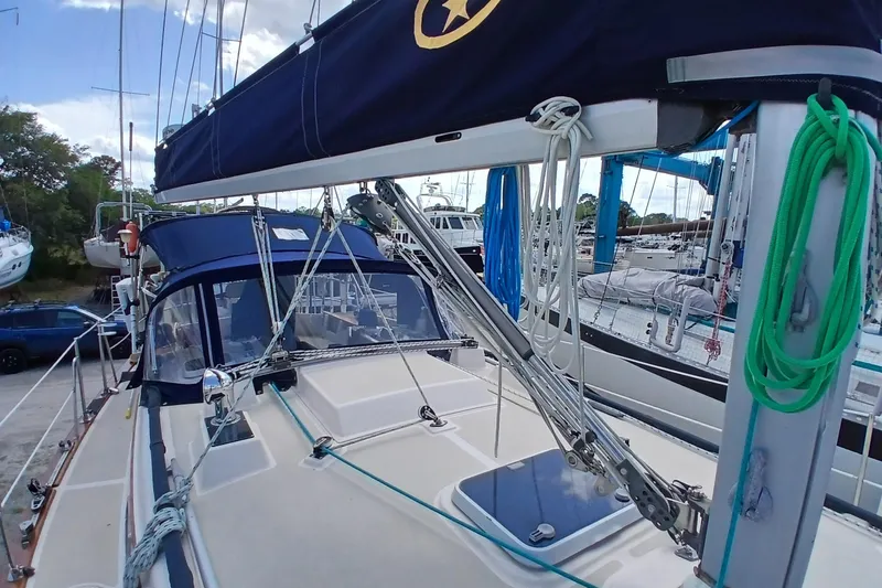 Slide: The Image of 1995 Island Packet 37 sailboat docked, featuring deck and rigging details. - 71