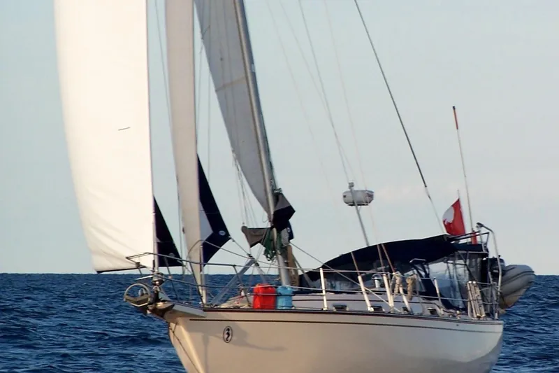 Slide: The Image of Sailing yacht Island Packet 37, 1995 model, cruising on open sea with full sails. - 78