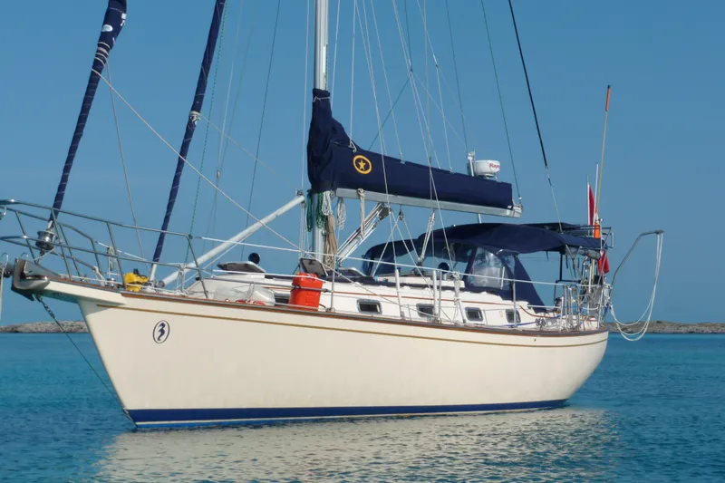 Slide: The Image of Island Packet 37 sailboat from 1995 on calm blue waters. - 82