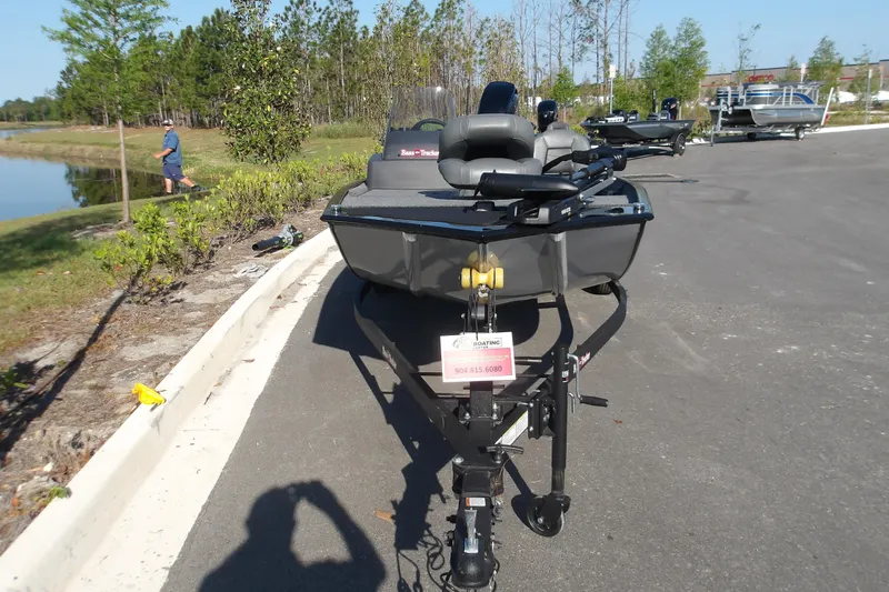 Slide: The Image of 2026 Tracker Bass Tracker Classic XL boat on trailer near a lake. - 3