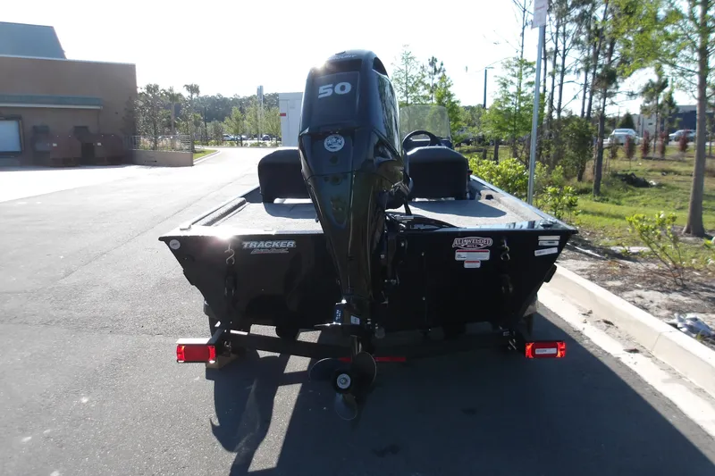 Slide: The Image of 2026 Tracker Bass Tracker Classic XL boat with 50 HP engine on a trailer. - 9