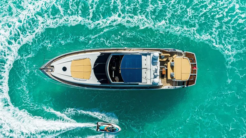 The Image of Aerial view of 2011 Sunseeker 64 Predator yacht on turquoise water. - 0