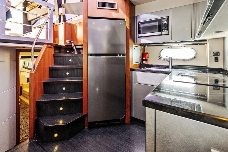 Slide: The Image of Luxurious kitchen interior of 2011 Sunseeker 64 Predator yacht with modern appliances. - 14