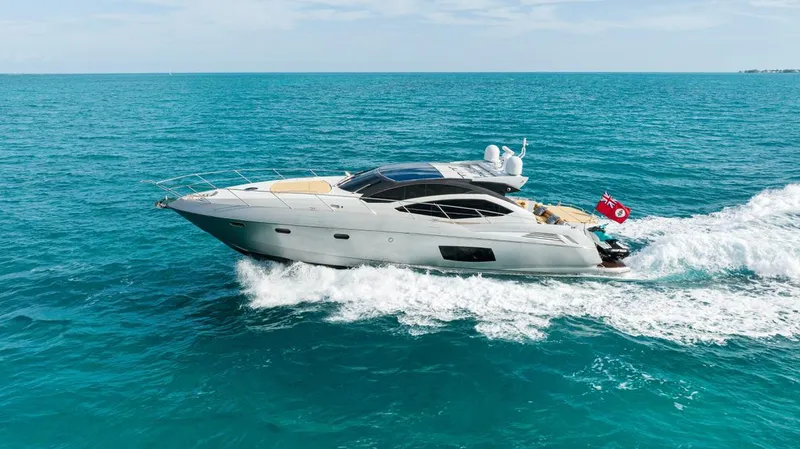 Slide: The Image of 2011 Sunseeker 64 Predator yacht cruising on open blue sea. - 2