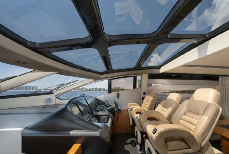 Slide: The Image of Luxurious interior of 2011 Sunseeker 64 Predator yacht with panoramic sunroof and plush seating. - 7