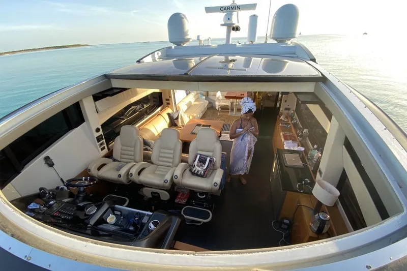 Slide: The Image of Luxurious 2011 Sunseeker Predator 64 yacht interior with seating and ocean view. - 8