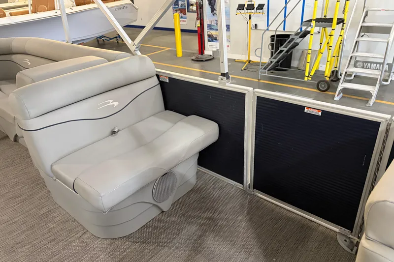 Slide: The Image of 2023 Bennington S22 pontoon boat interior with gray seating and modern design. - 21