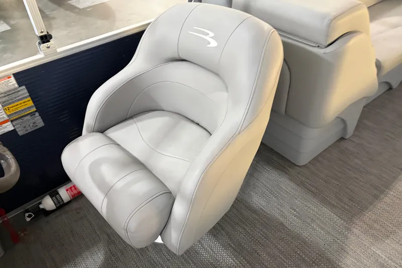Slide: The Image of 2023 Bennington S22 boat seat with gray upholstery and ergonomic design. - 22