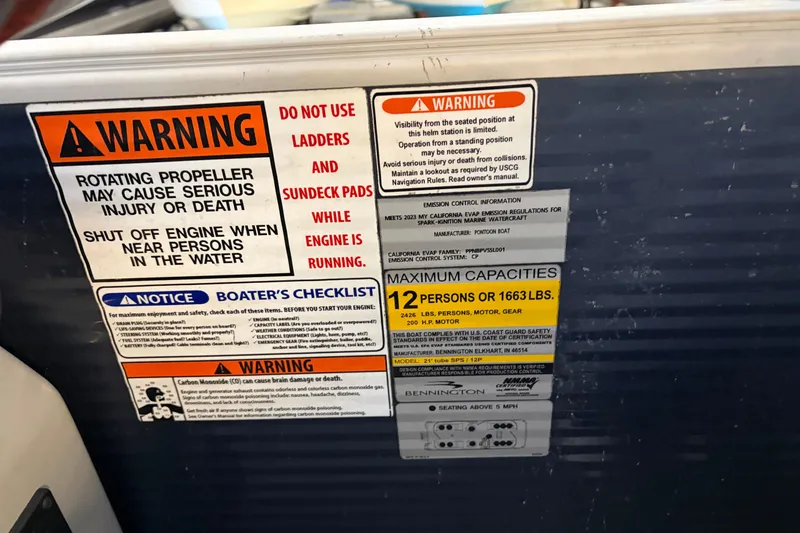 Slide: The Image of 2023 Bennington S22 warning labels and capacity information, highlighting safety precautions and maximum load. - 24
