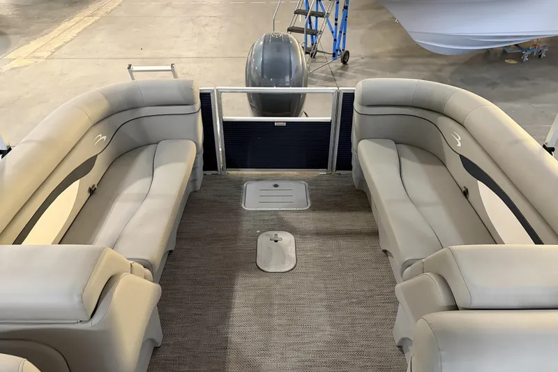 Slide: The Image of 2023 Bennington S22 pontoon boat interior with plush seating and modern design. - 25