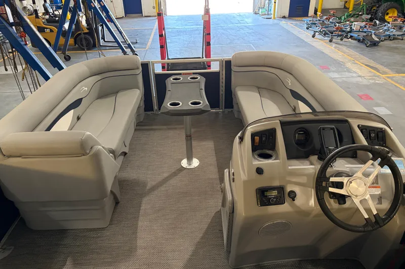 Slide: The Image of 2023 Bennington S22 pontoon boat interior with seating and steering console. - 28