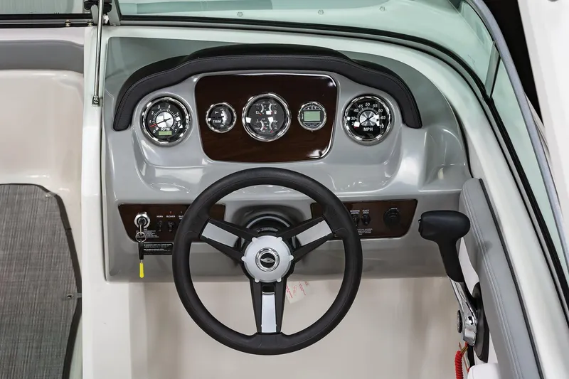 Slide: The Image of Manufacturer Provided Image: 2019 Chaparral 23 H2O Sport boat dashboard with steering wheel and gauges. - 4