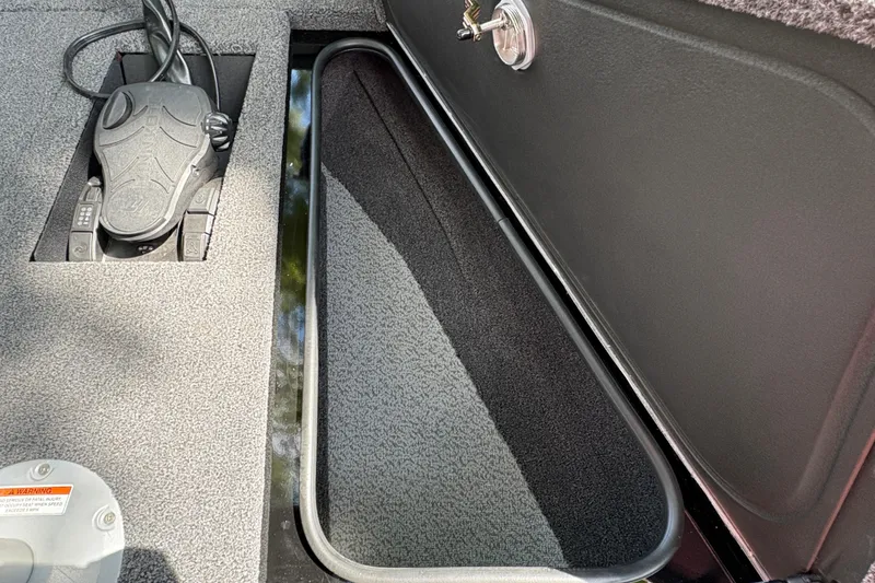 Slide: The Image of Interior view of 2026 Lund 2075 Pro-V Sport boat storage compartment. - 11