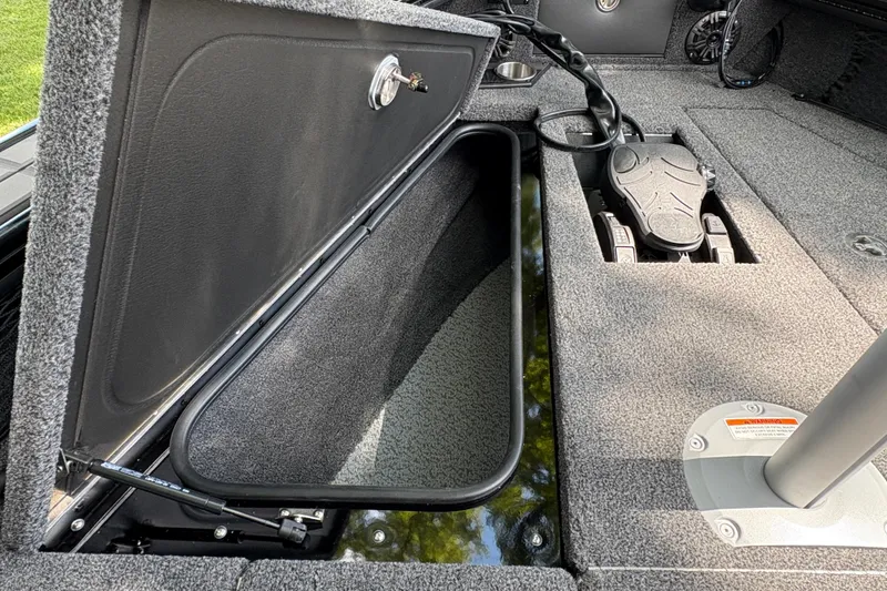 Slide: The Image of Open storage compartment in 2026 Lund 2075 Pro-V Sport boat interior. - 12