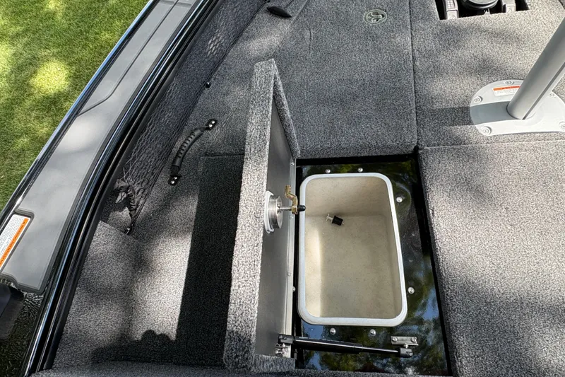 Slide: The Image of Open storage compartment on 2026 Lund 2075 Pro-V Sport boat deck. - 13