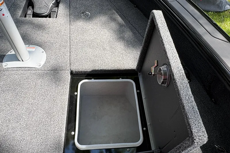 Slide: The Image of Open storage compartment on 2026 Lund 2075 Pro-V Sport boat deck. - 14
