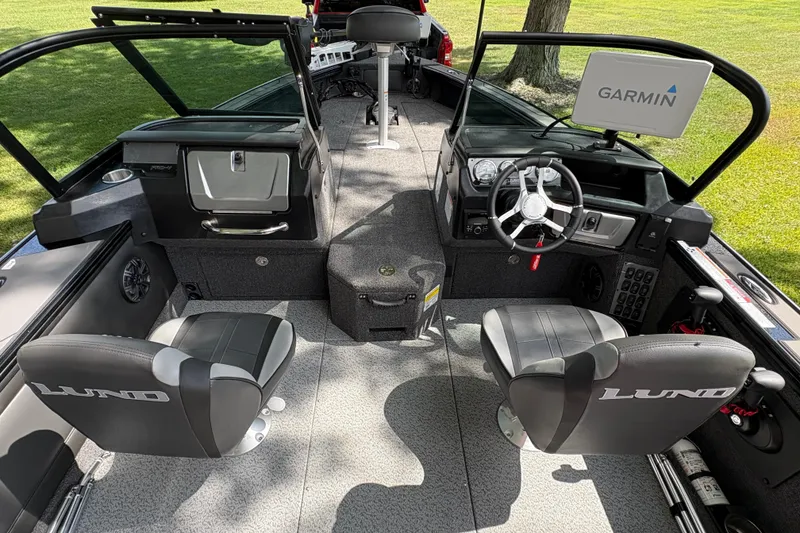 Slide: The Image of 2026 Lund 2075 Pro-V Sport boat interior with Garmin display and dual seats. - 19