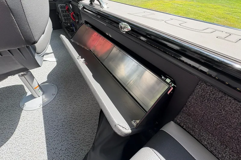 Slide: The Image of Interior view of 2026 Lund 2075 Pro-V Sport boat, featuring storage compartment and seating. - 28