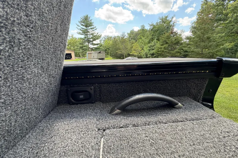 Slide: The Image of Interior view of 2026 Lund 2075 Pro-V Sport boat with carpeted finish and handle. - 39